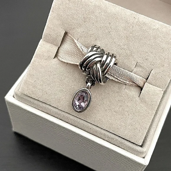 Pandora tied together charm